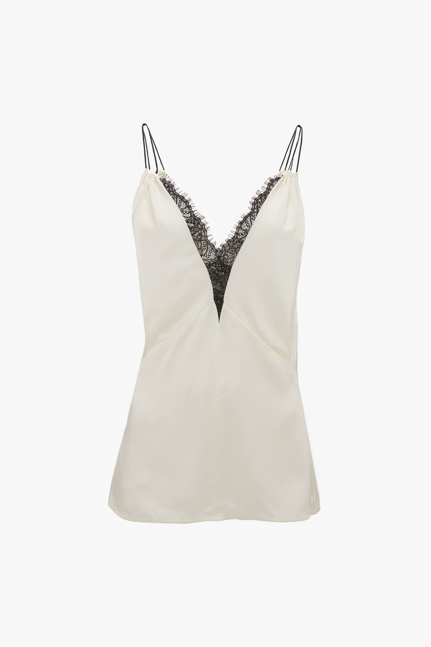 A Lace Detail Cami Top In Harvest Ivory by Victoria Beckham with a deep V-neckline adorned with black lace trim and thin black shoulder straps.