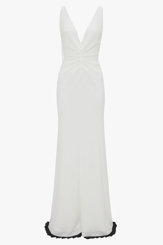 Exclusive V-Neck Gathered Waist Floor-Length Gown In Ivory by Victoria Beckham: Sleeveless white gown with a deep V-neckline and ruching at the waist, extending into a floor-length skirt to create an hourglass silhouette.