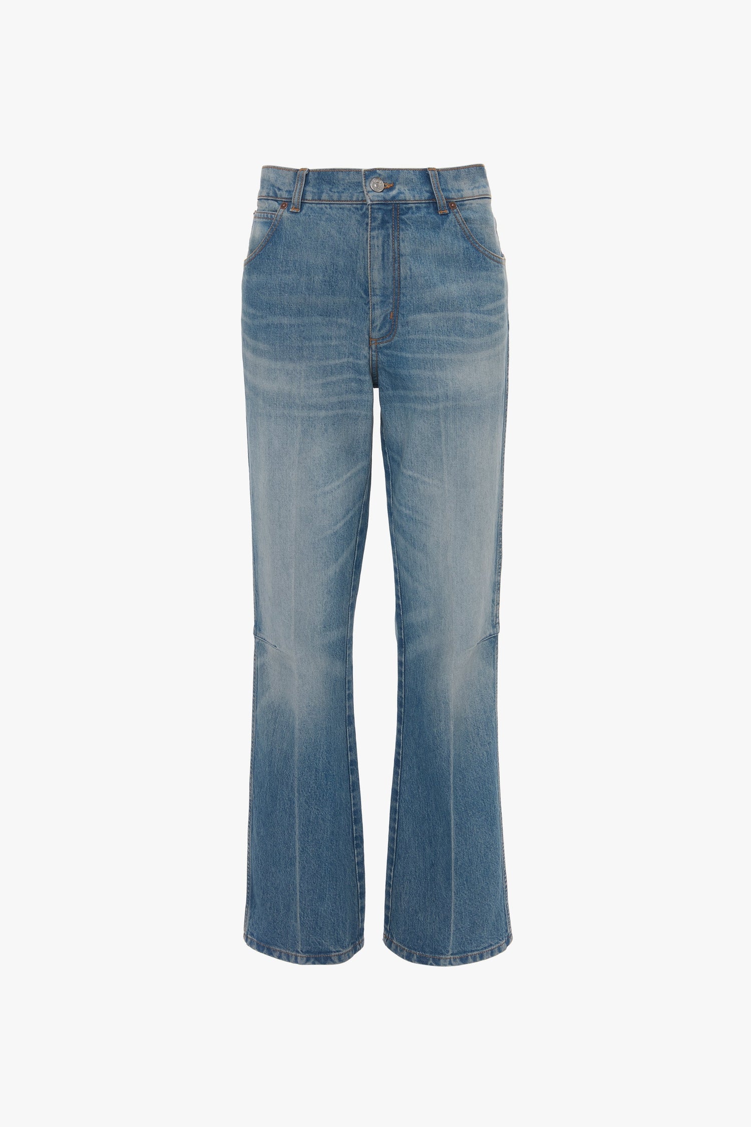 A pair of Relaxed Flared Jean In Broken Vintage Wash by Victoria Beckham with a straight leg cut, front pockets, and belt loops against a white background, featuring subtle deconstructed detailing.