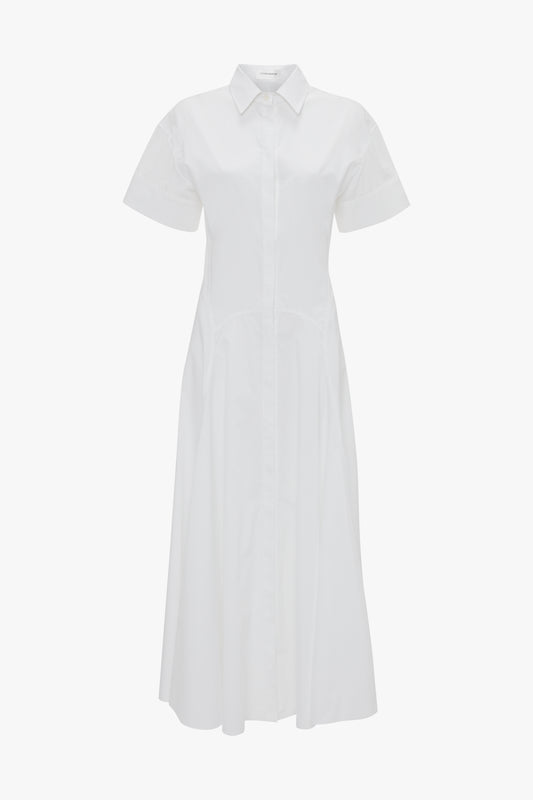 **Victoria Beckham Panelled Shirt Dress In White:** White short-sleeve, button-front collared midi dress in organic cotton poplin, featuring a tailored design on a plain background.