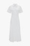 **Victoria Beckham Panelled Shirt Dress In White:** White short-sleeve, button-front collared midi dress in organic cotton poplin, featuring a tailored design on a plain background.