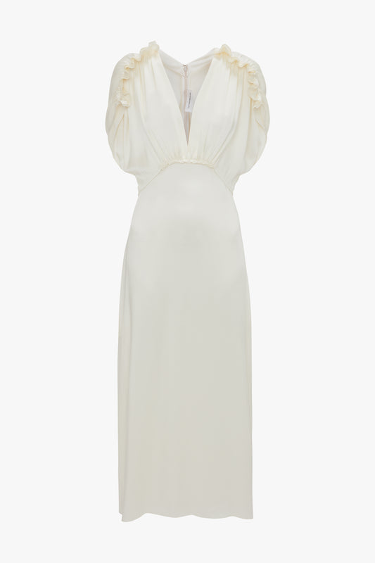 A sleeveless, knee-length Exclusive V-Neck Ruffle Midi Dress In Ivory by Victoria Beckham, featuring a fluid crepe back satin fabric, with ruched detailing on the shoulders.