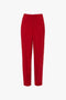 Tapered Leg Trouser In Carmine with a high waist and tailored fit, showcasing traditional tailoring for a lean silhouette by Victoria Beckham, shown against a white background.