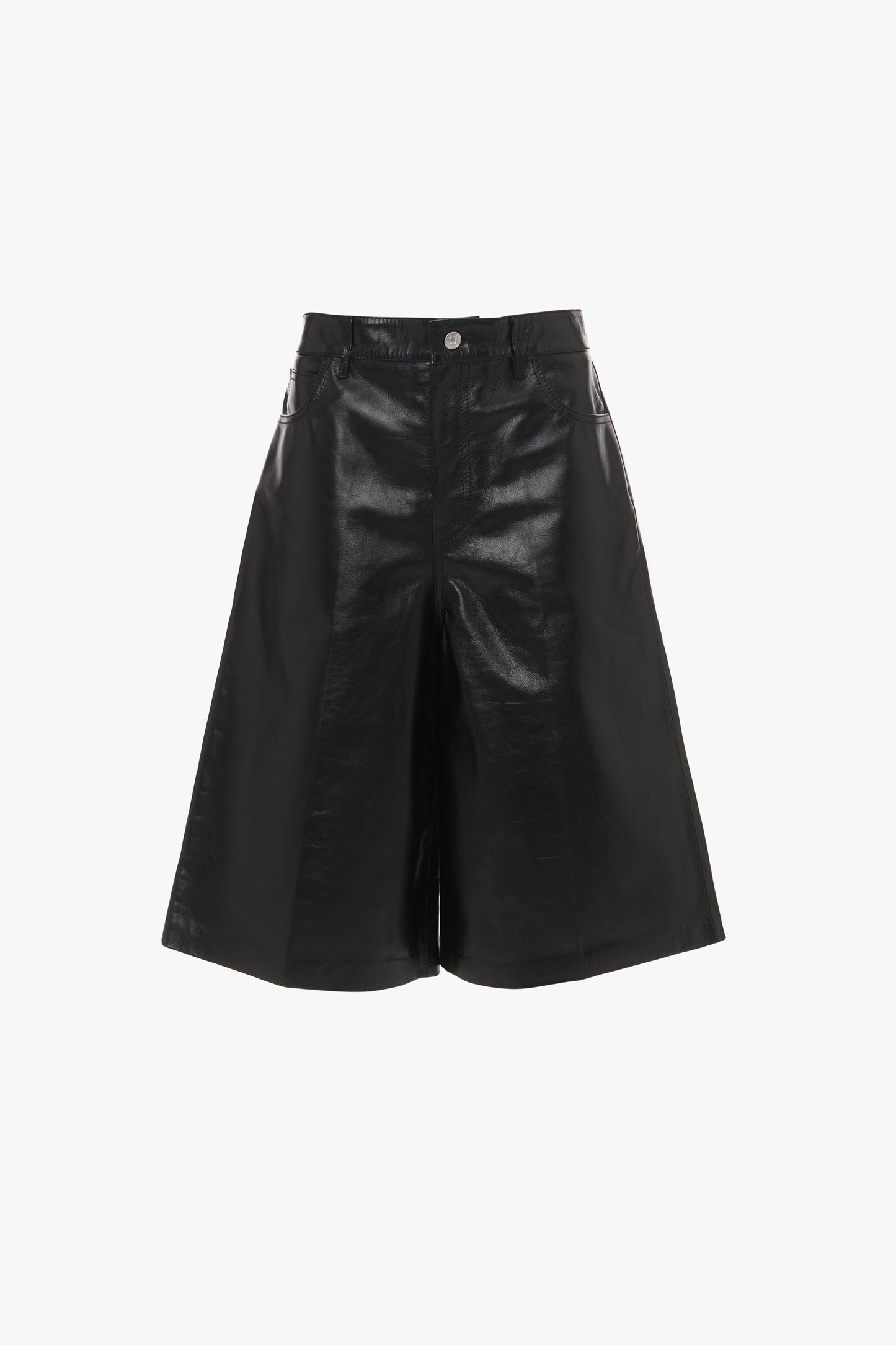 Black **Leather Bermuda Short In Black** with a high waist, front button, and zipper closure by **Victoria Beckham**. The shorts feature five-pocket detailing and have a sleek, glossy finish that reaches just above the knees.