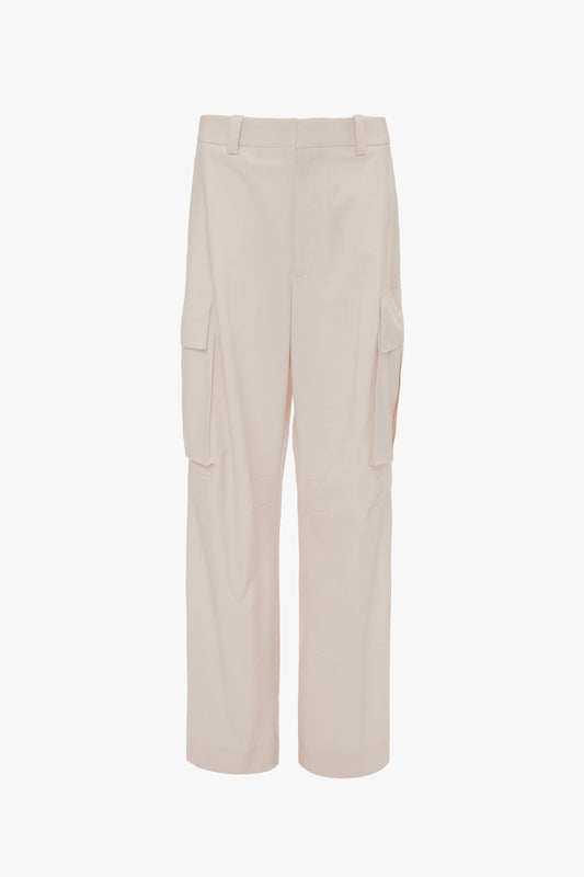 Relaxed Cargo Trouser In Bone by Victoria Beckham with multiple pockets and belt loops, made from 100% cotton and photographed against a plain white background.