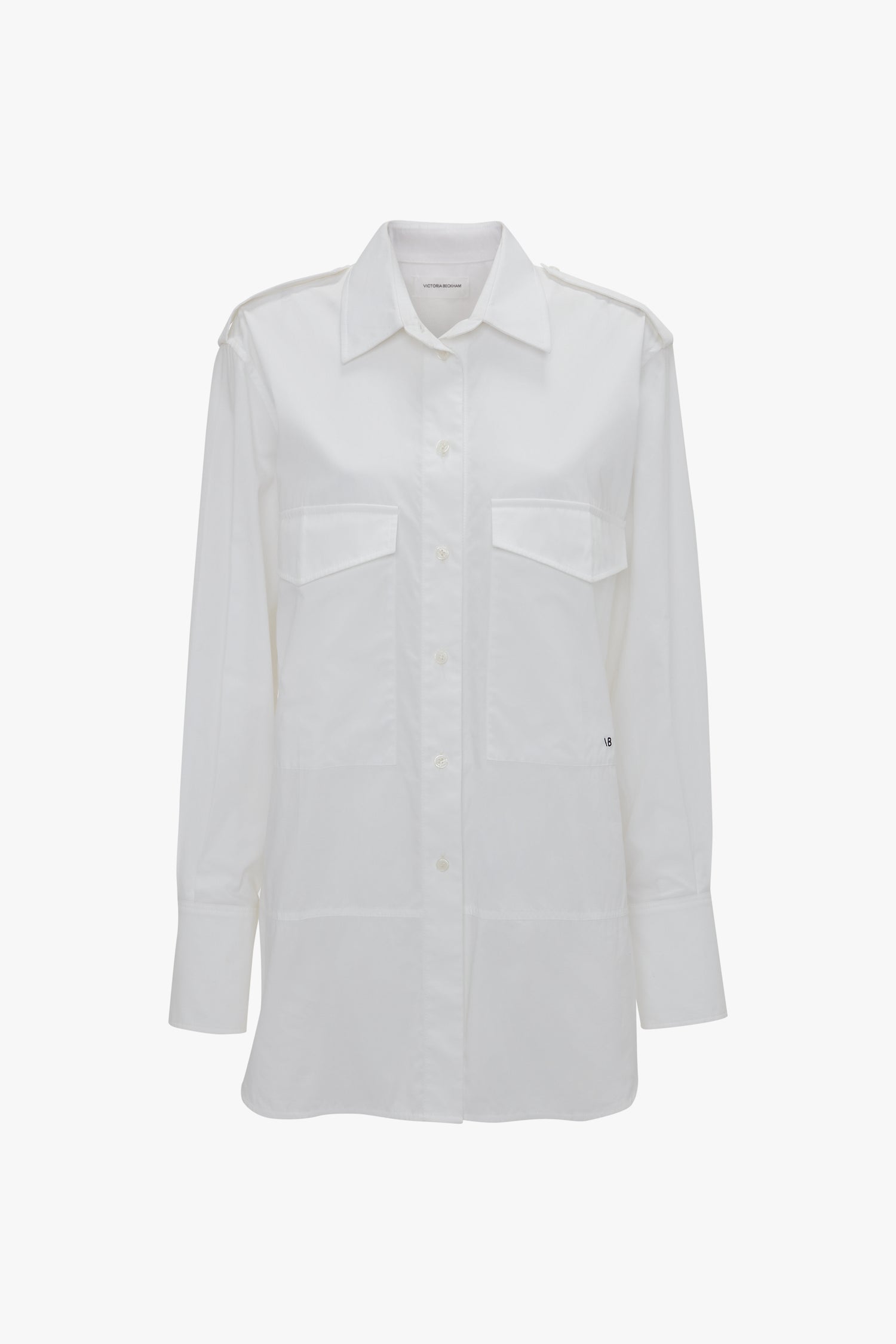 Image of a long-sleeve white button-up shirt with two chest pockets and a pointed collar, crafted from organic cotton. The Oversized Pocket Shirt In White by Victoria Beckham.