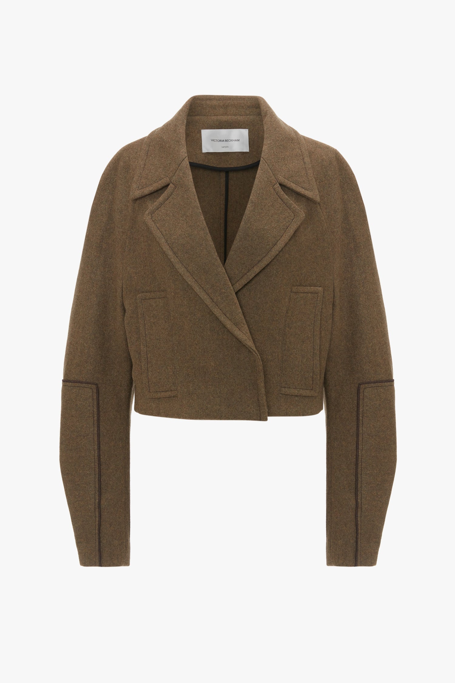 A waist-defining brown Cropped Pea Coat In Khaki by Victoria Beckham in luxurious merino wool, featuring a wide lapel, two front pockets, and intricate seam details.