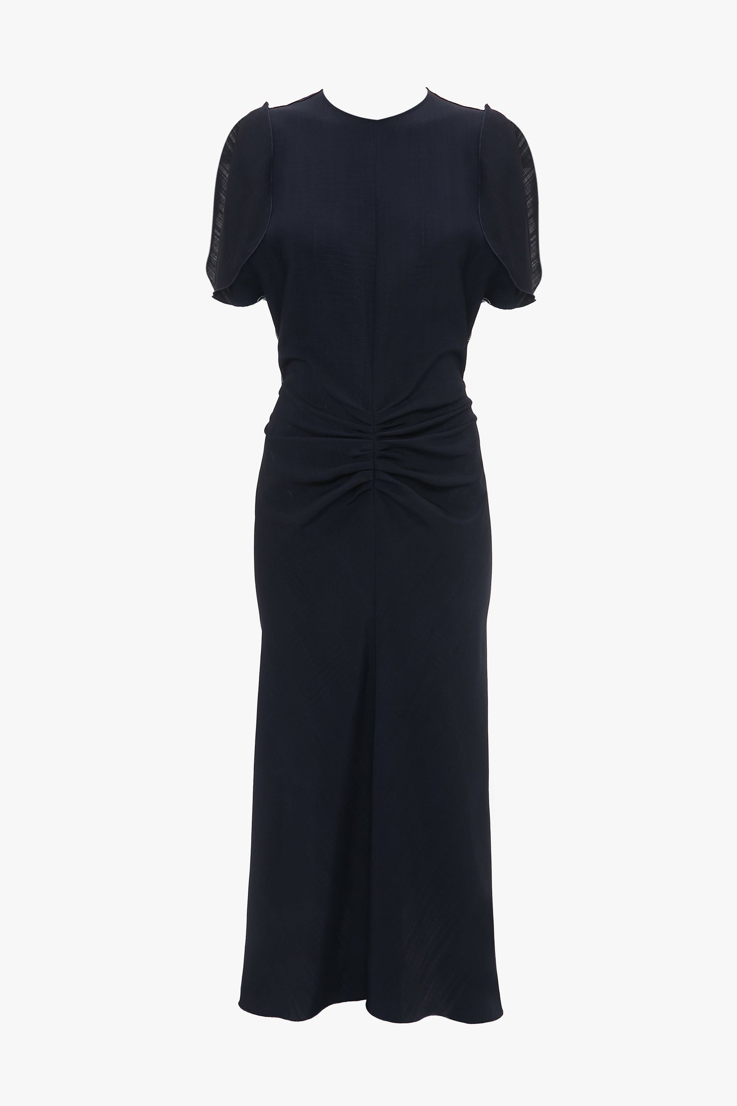 A Gathered V-Neck Midi Dress In Midnight by Victoria Beckham, a knee-length, short-sleeve, dark blue fit-and-flare silhouette dress with a high neckline, front ruched detail, and transparent fabric on the sleeves.