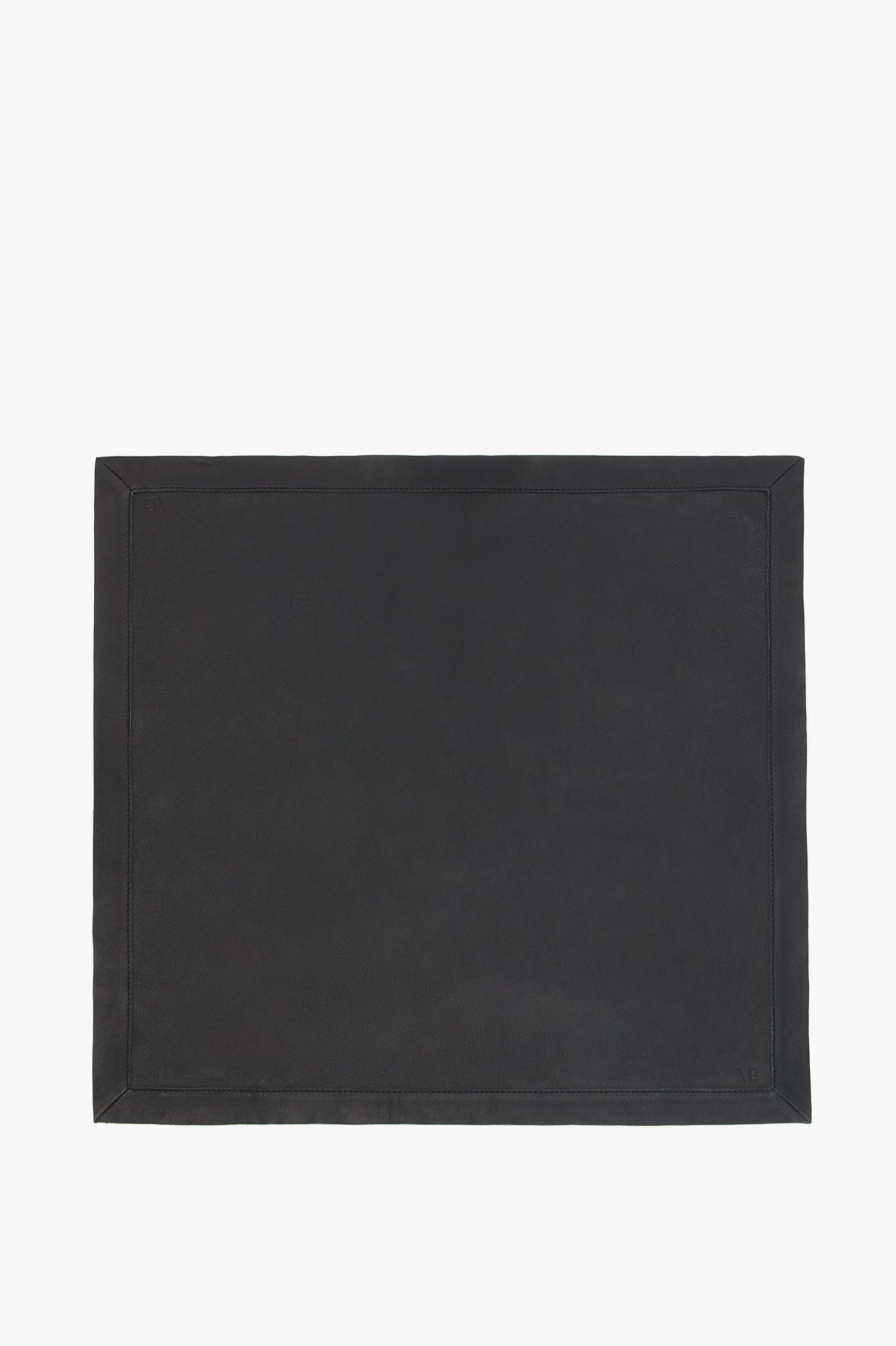 Foulard In Black Leather desk pad with a stitched border on a plain white background by Victoria Beckham.