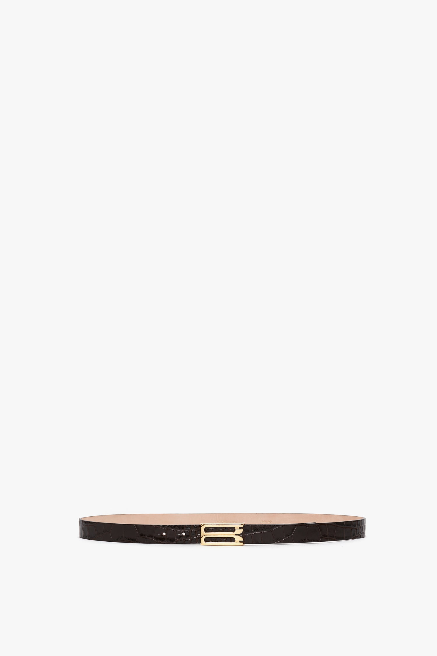 A thin, dark brown croc-embossed calf leather Victoria Beckham Frame Belt In Espresso Croc Embossed Calf Leather with a gold rectangular buckle, displayed against a plain white background.