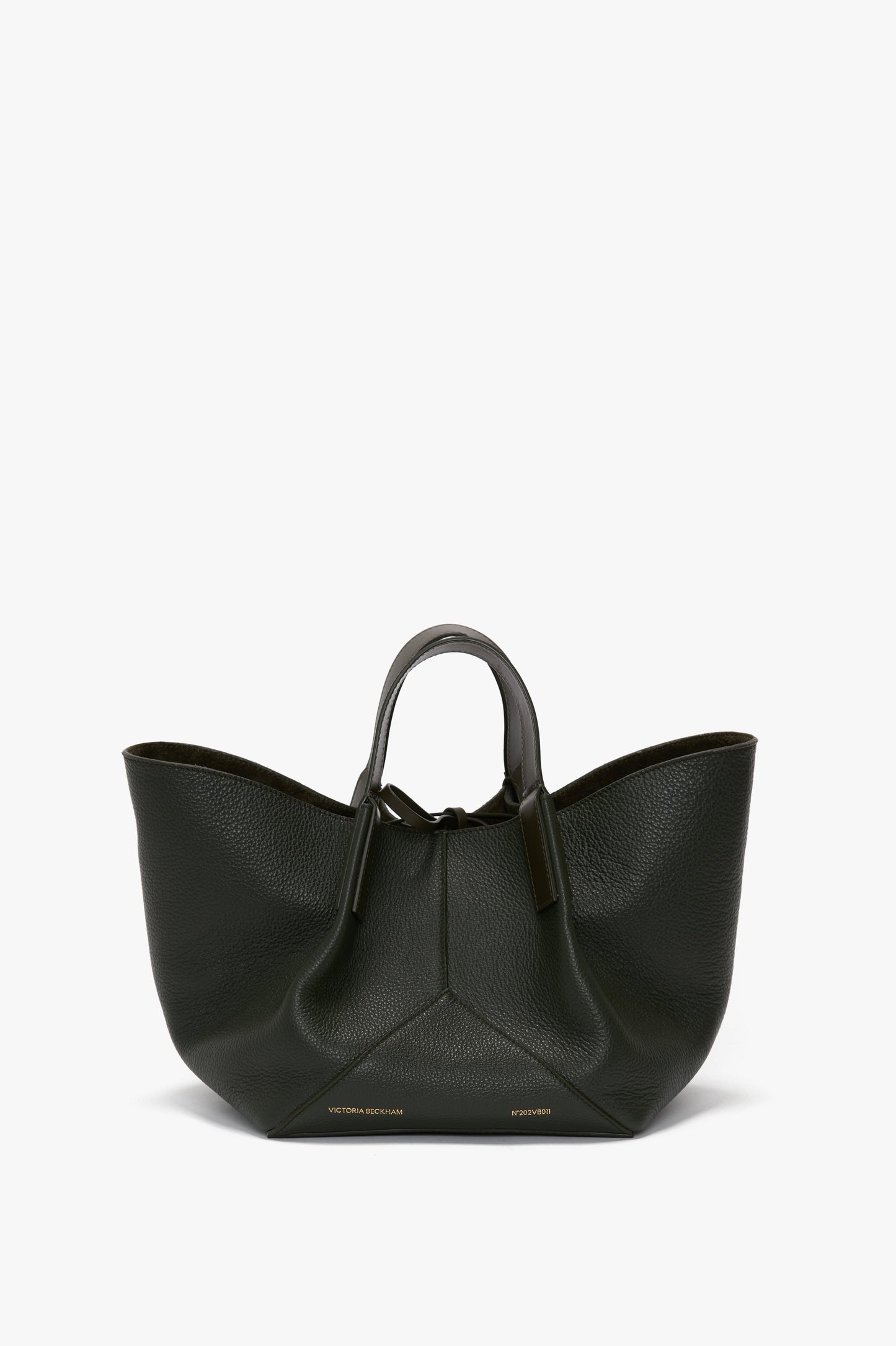 A W11 Mini Tote Bag In Loden Leather by Victoria Beckham with a structured, wide-winged design and short handles, set against a white background.