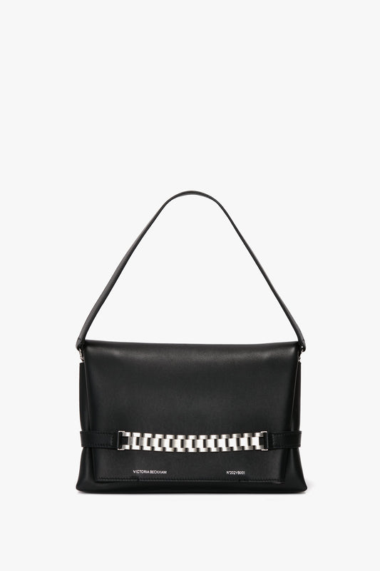 A black leather Chain Pouch Bag with Brushed Silver Chain In Black Leather, featuring silver Victoria Beckham branding and a single top handle.
