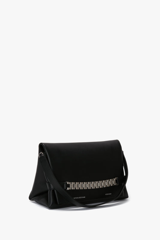 A sleek black leather Chain Pouch Bag with Brushed Silver Chain In Black Leather by Victoria Beckham, resting against a plain white background.