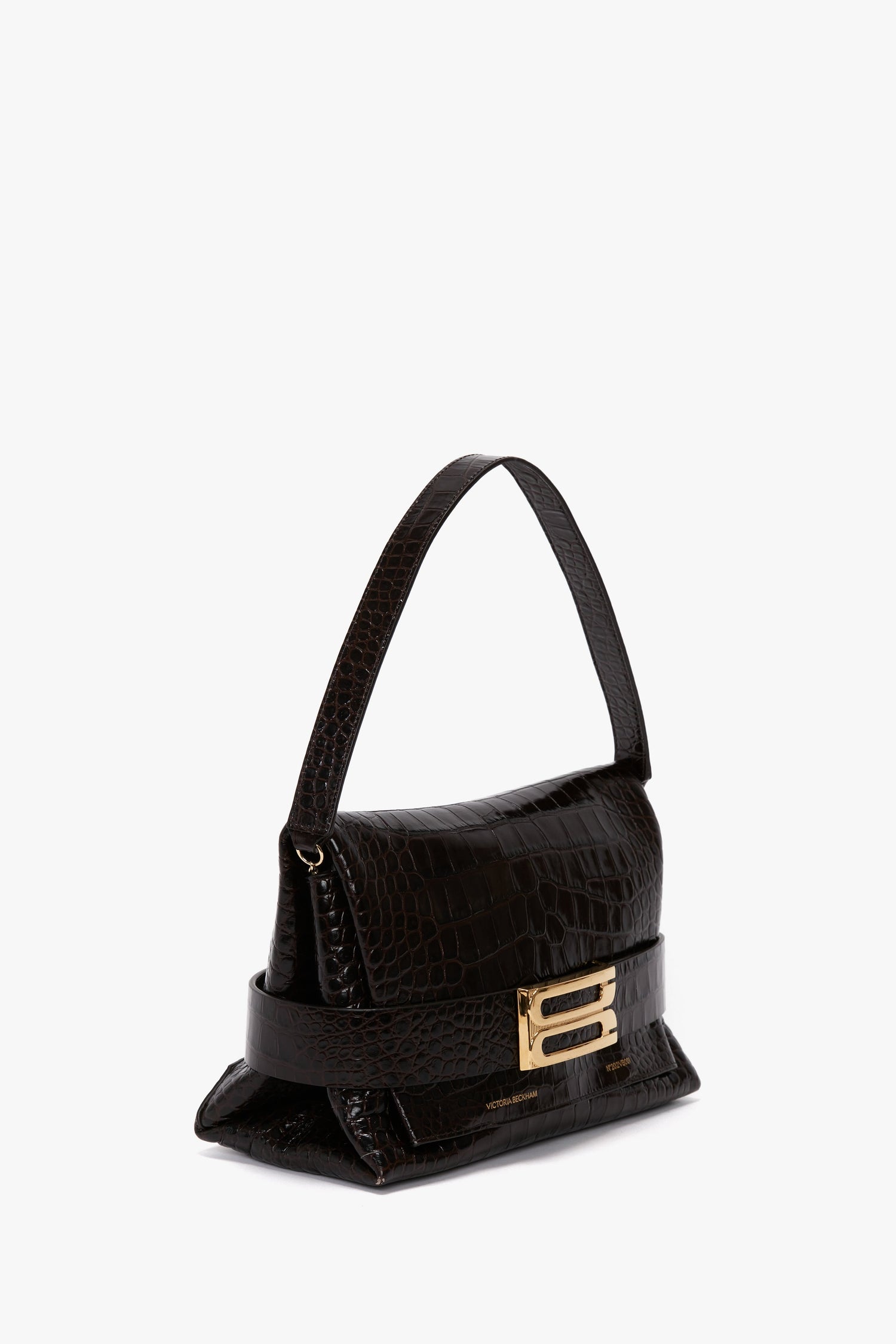Victoria Beckham B Pouch Bag In Croc Effect Espresso Leather with an embossed crocodile print, gold clasp, and a single shoulder strap.
