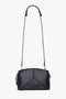 A black leather crossbody bag with gold accents, a thin adjustable shoulder strap, and geometric stitching on the front. This exquisite piece of leather goods features a top zipper closure and exudes elegance akin to the Exclusive Victoria Crossbody Bag In Navy Leather by Victoria Beckham.