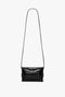 A Mini B Pouch Bag In Croc Effect Black Leather by Victoria Beckham with a long detachable crossbody strap, displayed against a white background.