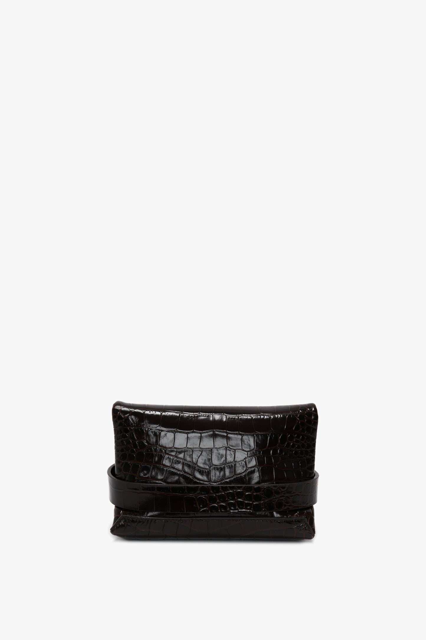 A black, rectangular Mini B Pouch Bag In Croc Effect Espresso Leather crafted from calf leather with a crocodile pattern, and featuring a detachable crossbody strap, shown against a plain white background by Victoria Beckham.