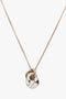 Victoria Beckham Exclusive Resin Pendant Necklace In Light Gold-White with a white, marbled resin pendant intertwined with three small gold rings and a T-bar closure.