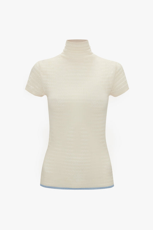 Cream-colored, short-sleeve Polo Neck Knitted T-Shirt In Cream by Victoria Beckham with a pointelle stitch pattern, displayed on a white background. Perfect as a trans-seasonal piece.