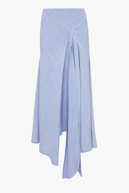 The Asymmetric Tie Detail Skirt In Frost by Victoria Beckham, crafted from light blue viscose crepe fabric, featuring an asymmetric hem and a long tie at the front, embodies modern femininity.