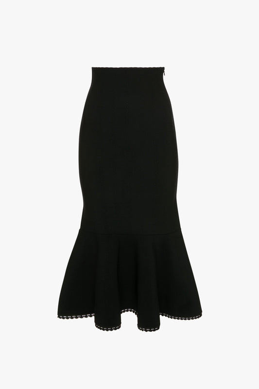 A black, high-waisted, form-fitting VB Body Scallop Trim Flared Skirt In Black by Victoria Beckham with a flattering flared silhouette and scalloped detailing at the edges, perfect for versatile styling.