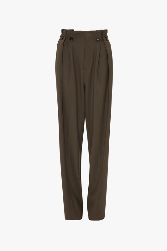 A pair of brown Gathered Waist Utility Trouser In Oregano from Victoria Beckham with pleats, button details at the waistband, adjustable side tabs, and a straight-leg fit.
