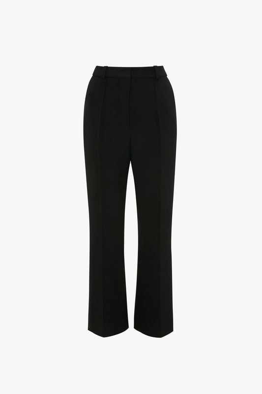 A pair of Cropped Kick Trouser In Black by Victoria Beckham with a straight-leg cut, belt loops, and a front crease on a white background.