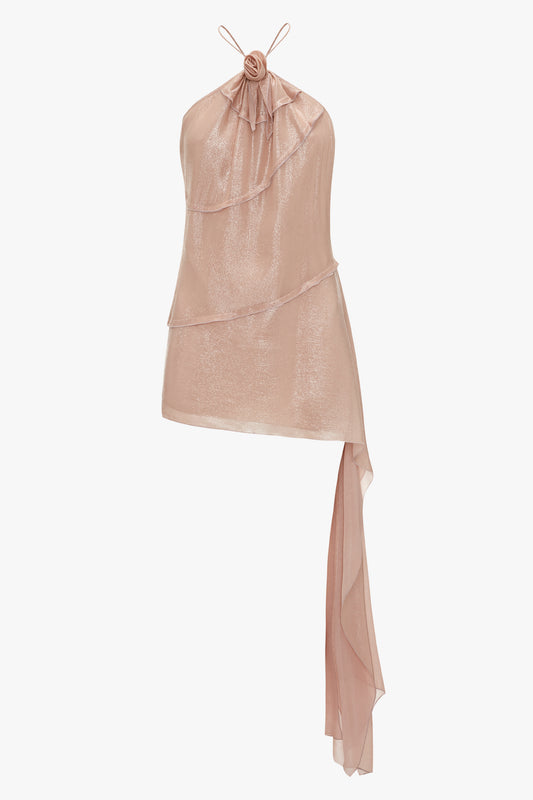 A sleeveless, shimmering rose gold Flower Detail Cami Top In Rosewater by Victoria Beckham featuring a high neckline with a floral embellishment and an asymmetrical draped hem.