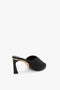 A V Cut Mule In Black Raffia by Victoria Beckham, photographed against a plain white background.