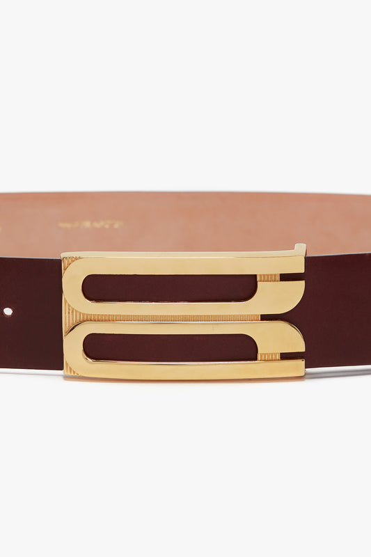A smooth calf leather Jumbo Frame Belt In Burgundy Leather by Victoria Beckham featuring a distinctive gold rectangular buckle with two parallel openings.