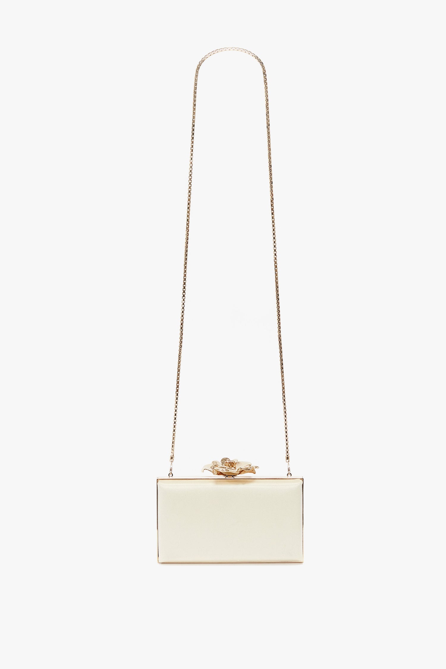 A small white rectangular Frame Flower Minaudiere in Bag Chamomile with a long gold chain strap and a floral embellishment on top, this accessory channels the chic elegance of Victoria Beckham.