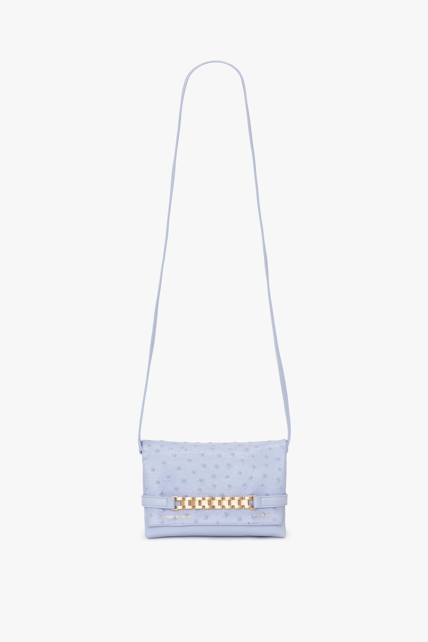 Light blue Mini Chain Pouch Bag With Long Strap In Frost Ostrich-Effect Leather by Victoria Beckham with a gold chain detail on the front.