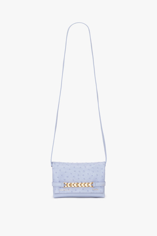 A Victoria Beckham Mini Chain Pouch With Long Strap In Frost Ostrich-Effect Leather, featuring an embossed ostrich-effect pattern, with a chain detail on the front flap and a long strap.