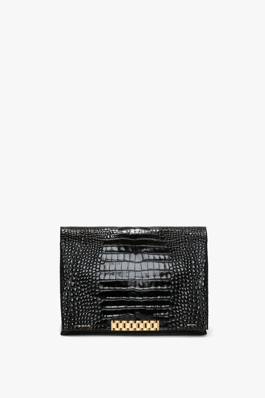Jumbo Chain Pouch in Black Croc-Effect Leather by Victoria Beckham with embossed croc leather and a gold rectangular clasp.
