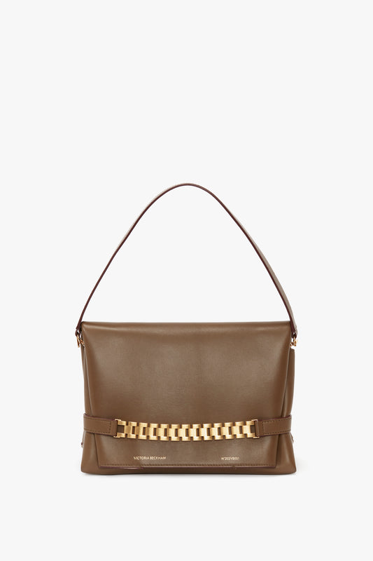 A brown Nappa leather handbag with a single strap and gold chain detail on the front, featuring a detachable strap for versatile styling.

A khaki leather Victoria Beckham Chain Pouch Bag With Strap, featuring a single strap and gold chain detail on the front for versatile styling.