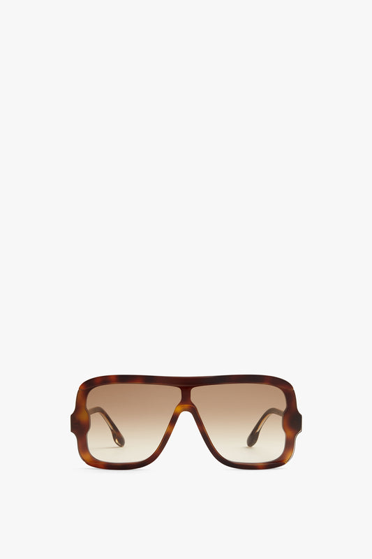 A pair of Victoria Beckham Layered Mask Sunglasses In Tortoise-Brown, viewed from the front against a plain white background.