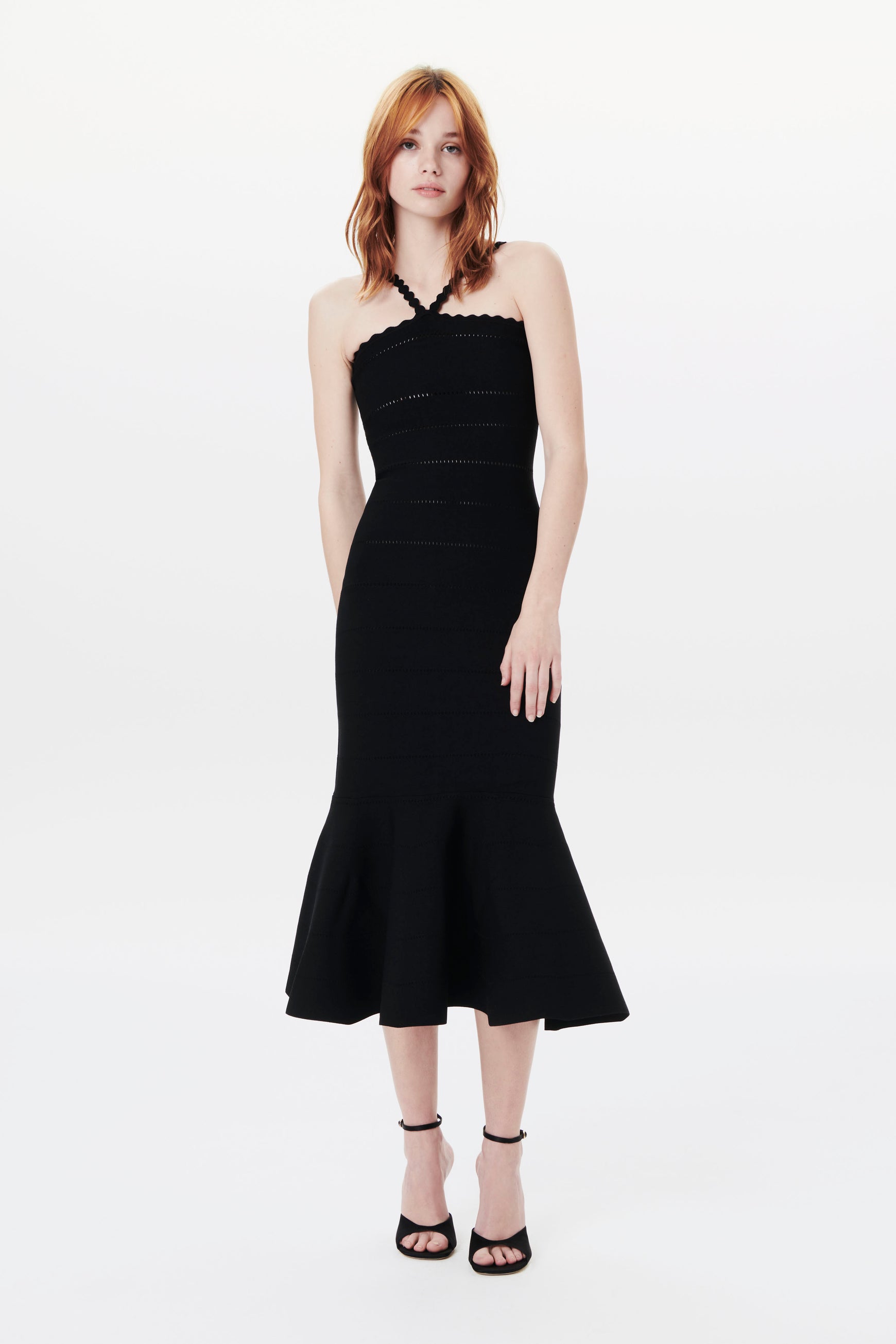 The Scalloped Strap Flare Dress in Black from Victoria Beckham is made from compact viscose fabrics with thin straps, brings a feminine feel for its body-con style with flounced hem.