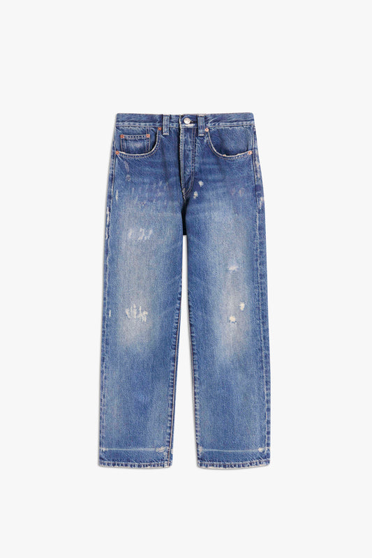 A pair of blue Victoria Mid-Rise Jean in Vintage Wash by Victoria Beckham with a slightly distressed look, featuring light fading and small ripped patches. Made from 100% cotton for ultimate comfort and durability.