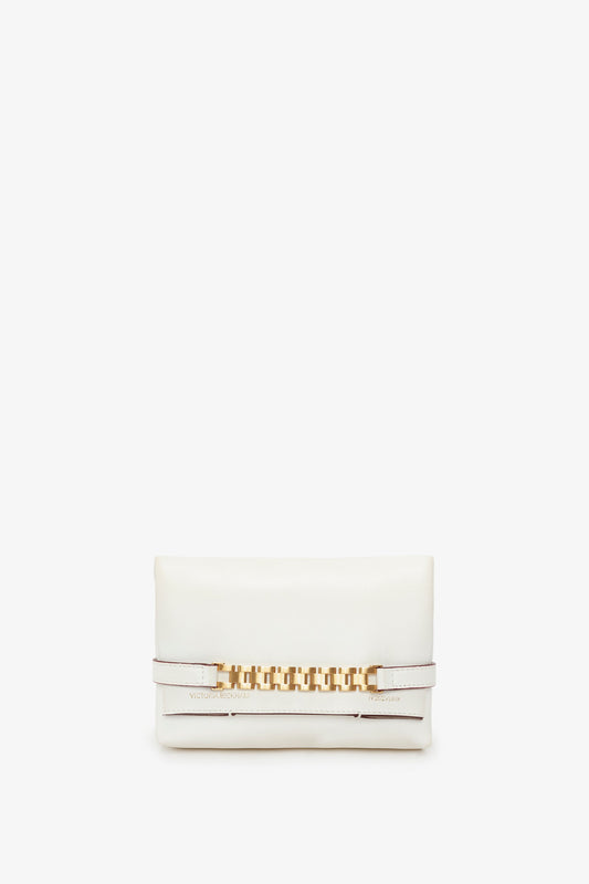 Mini Chain Pouch Bag With Long Strap In White Leather from Victoria Beckham, featuring a gold chain detail on the front and a removable strap.