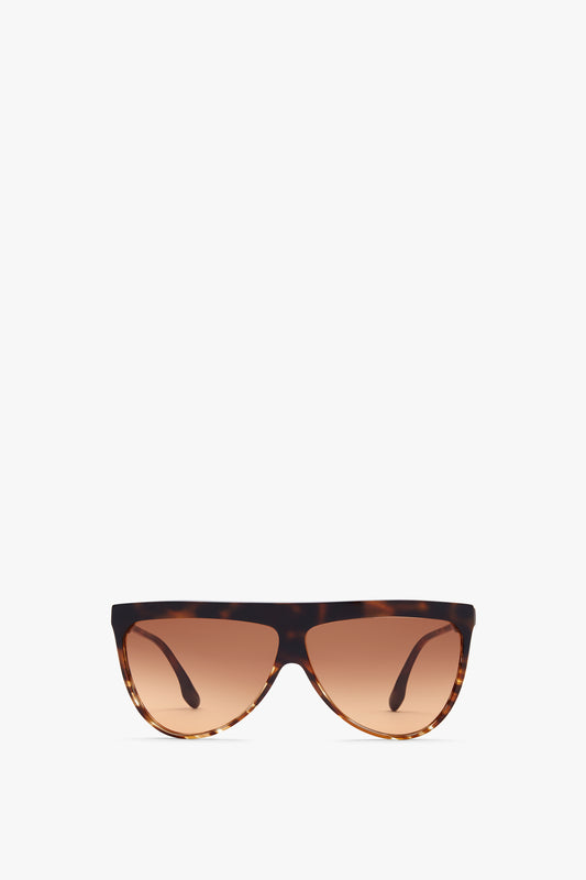 Flat Top V Sunglasses In Striped Dark Havana by Victoria Beckham, with gradient brown lenses and acetate temples, made in Italy, displayed against a plain white background.