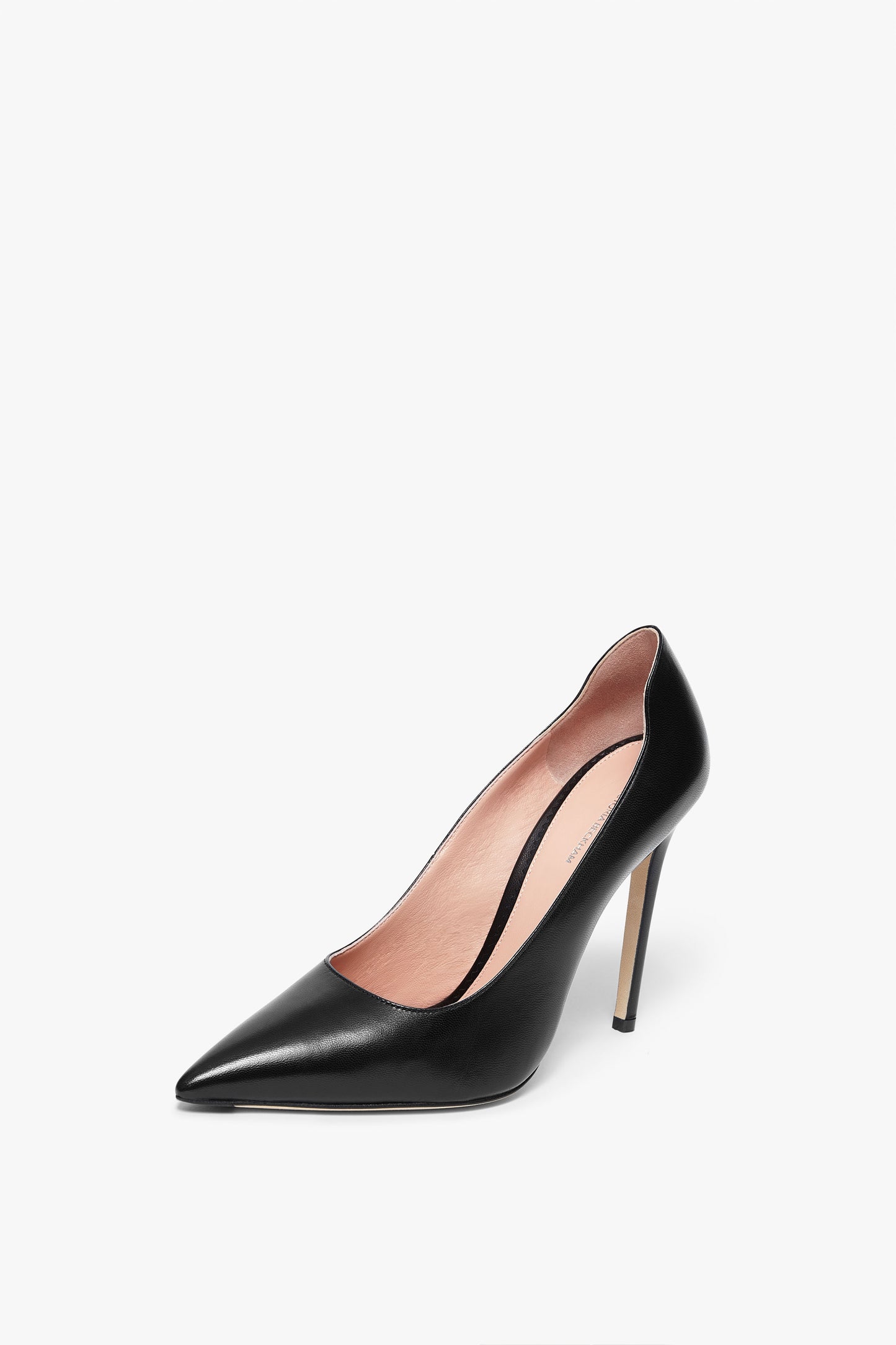 A single black leather stiletto with a pointed toe, embodying sophistication, and featuring an elegant back detail. This VB Pump 115mm in Black by Victoria Beckham is the epitome of timeless style.