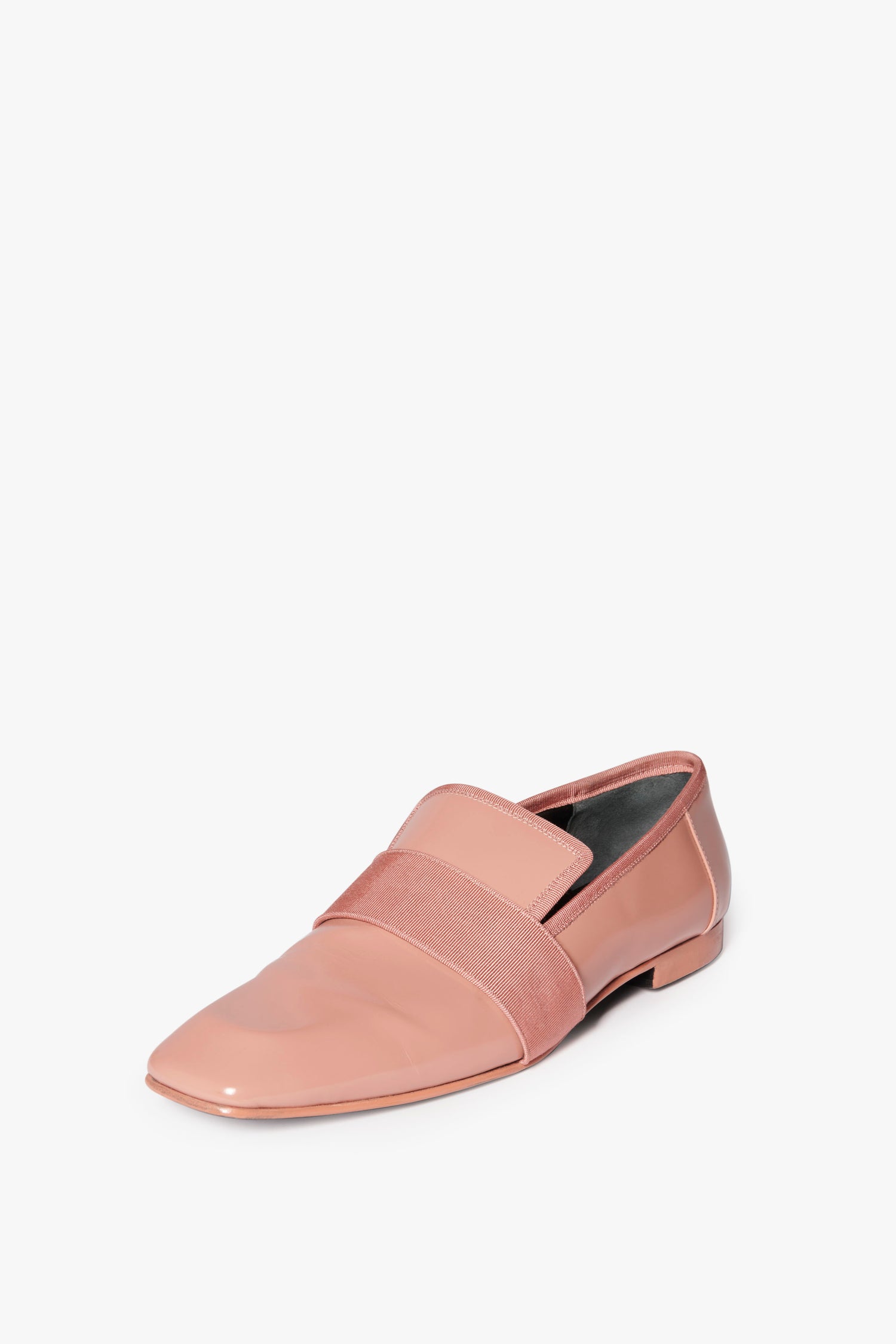 A single Debbie Loafer in Rose by Victoria Beckham, featuring a wide, pink fabric band across the upper and a chic square-toe design, placed on a plain white background.