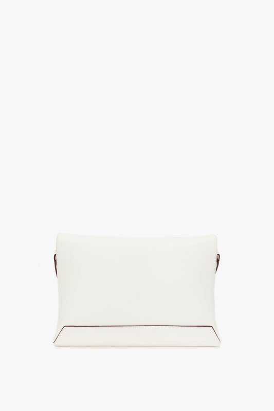 A Victoria Beckham Chain Pouch with Strap In White Leather with a minimalistic design and subtle brown accents at the edges, isolated on a white background.