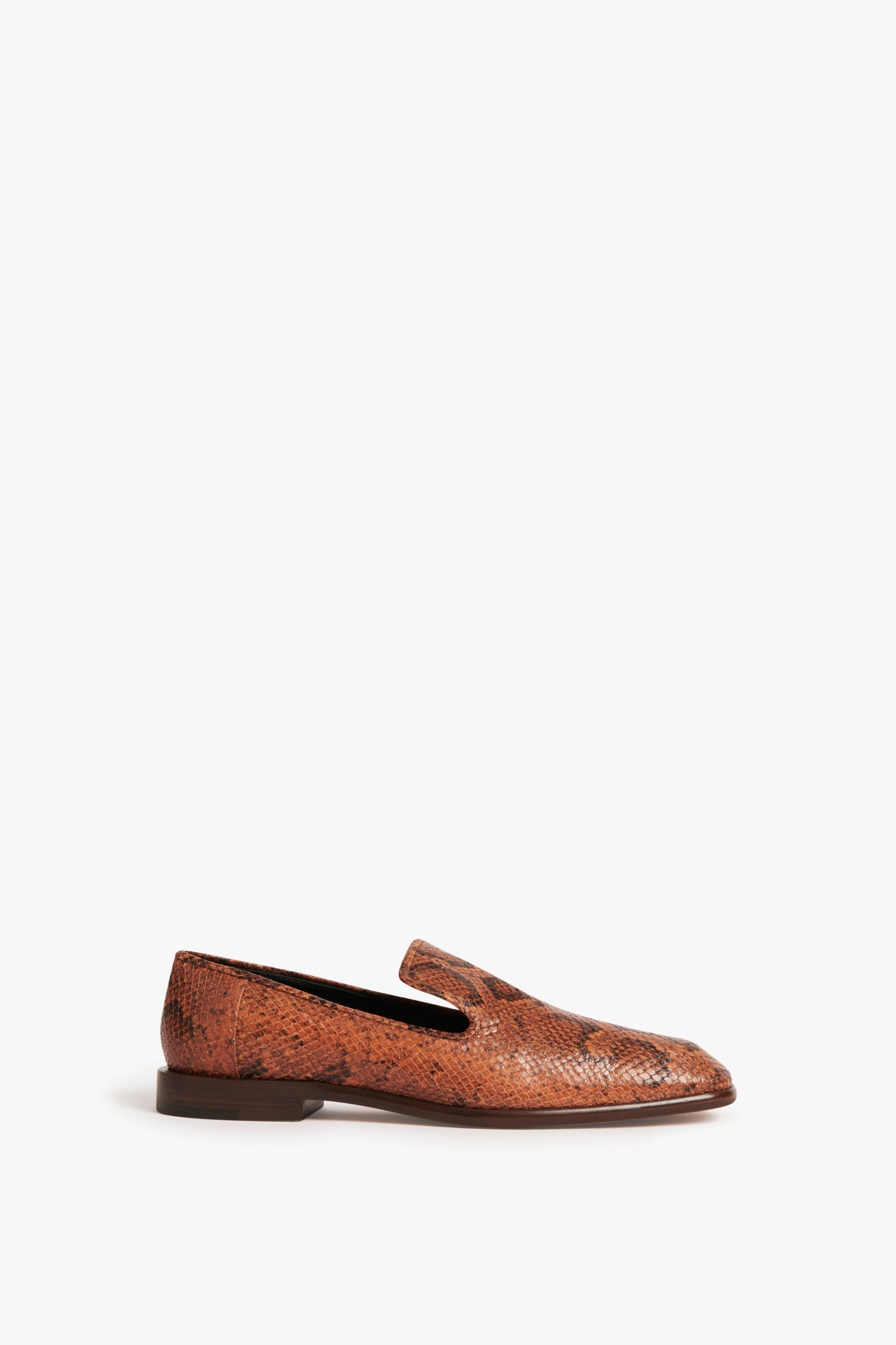 A single traditional brown snakeskin loafer with a flat heel on a plain white background, epitomizing the sophisticated style of Spring Summer 2022, is replaced by the Hanna Loafer in Copper Snake Print by Victoria Beckham.