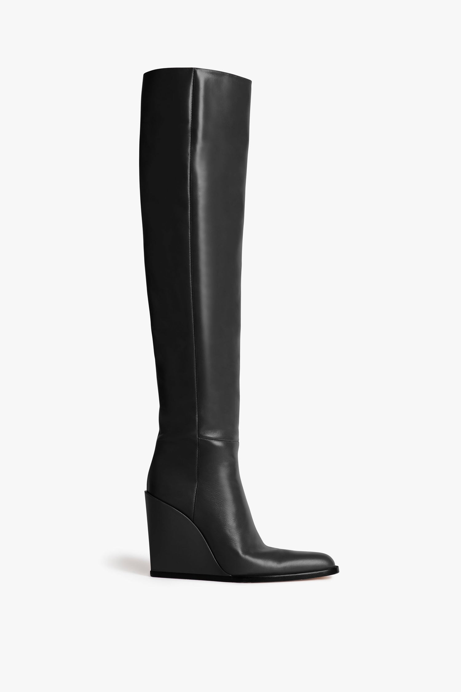 A single Sky Boot In Black by Victoria Beckham with a sculptural heel and pointed toe, crafted from stretch calf leather, is shown from the side against a plain white background.