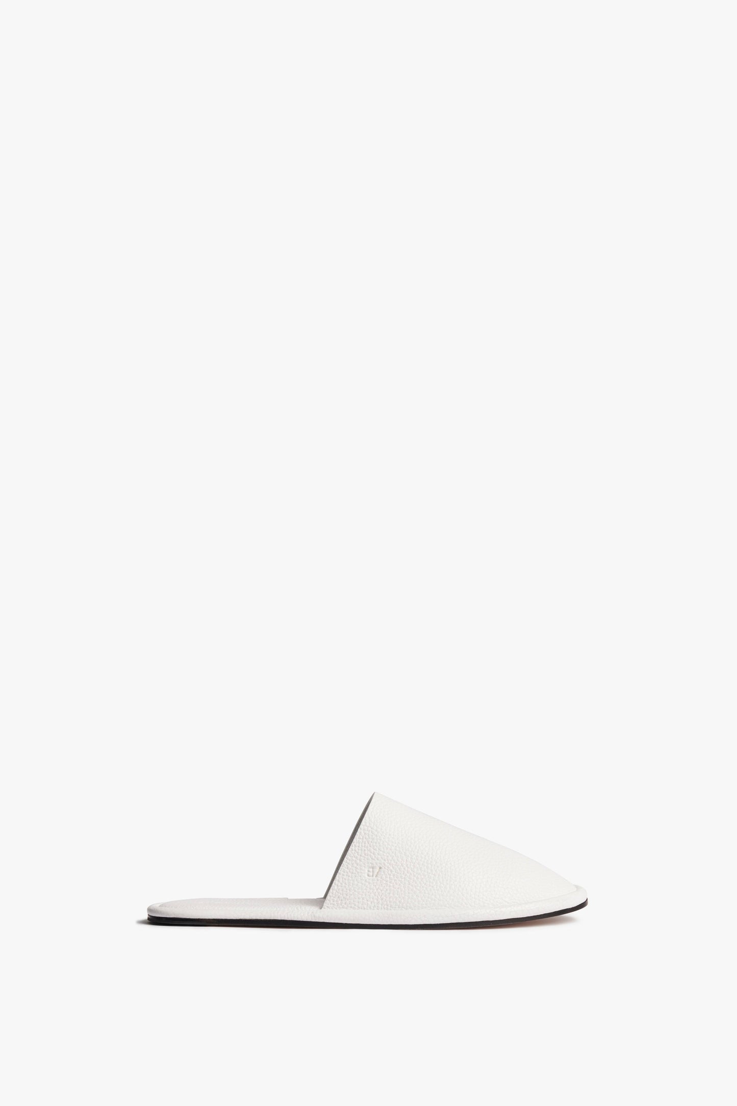A plain white Victoria Beckham Amelia Leather Mule in White with a closed toe and open heel, displayed on a white background.