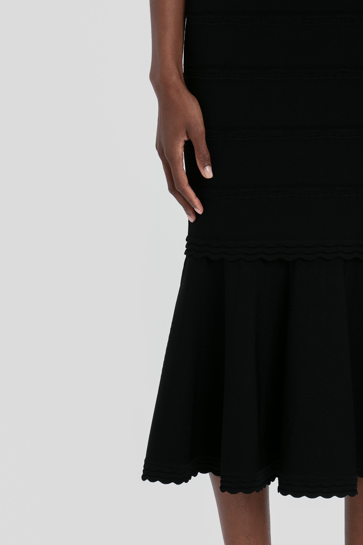 Stretch Knit Sleeveless Flared Dress In Black
