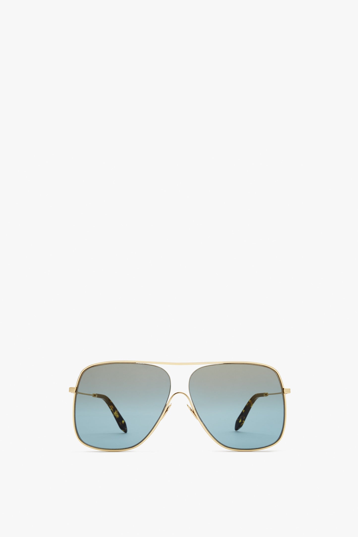 A pair of Loop Navigator in Celeste sunglasses with gold frames and gradient blue lenses on a plain white background, embodying classic Aviator style. Made in Italy, these Victoria Beckham sunglasses are the epitome of luxury and craftsmanship.