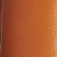 Close-up of a smooth, brown calf leather upper with visible thong construction detail on the left side of the Eve Flat Sandal in Tan by Victoria Beckham.