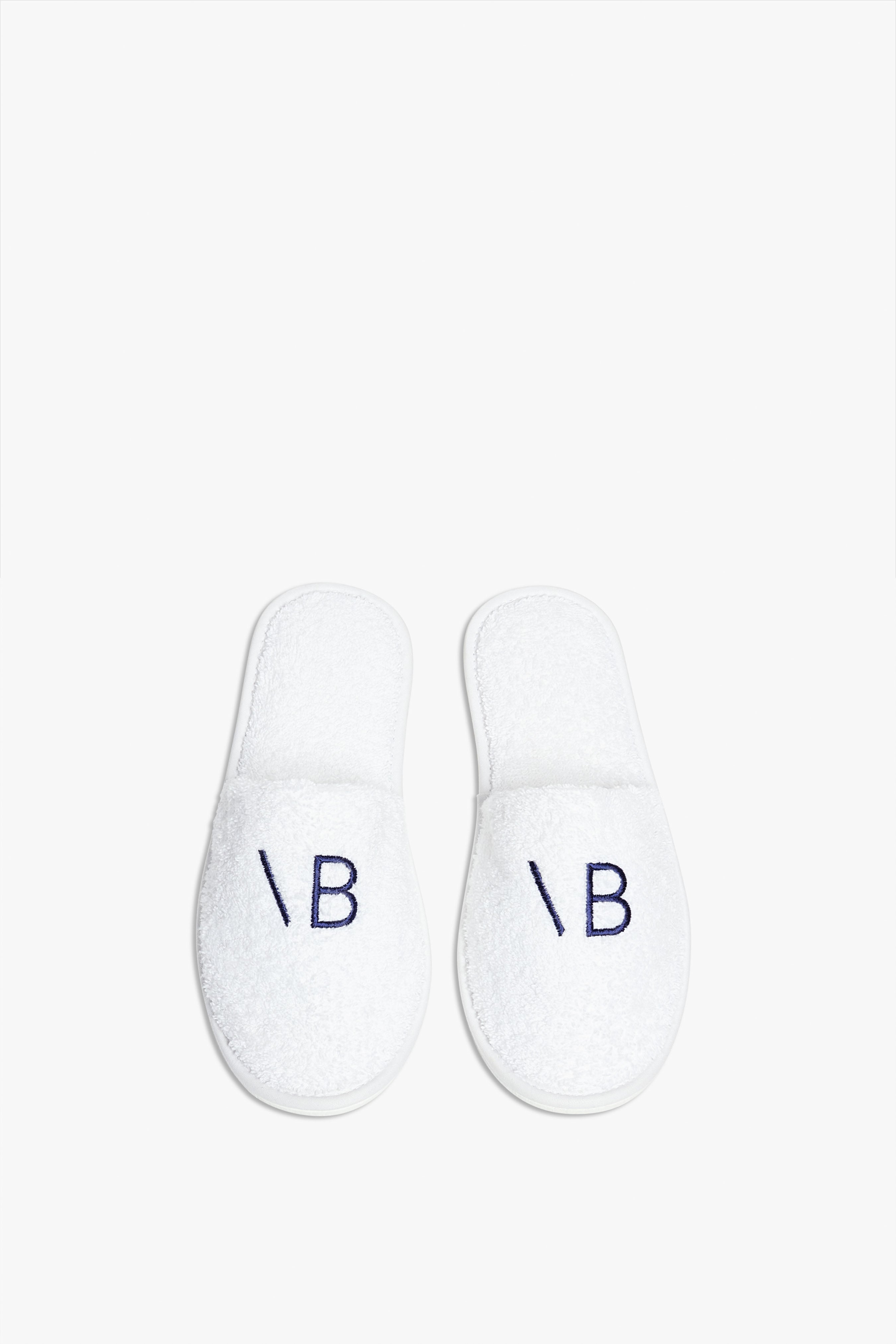 Embroidered hotel slippers on sale